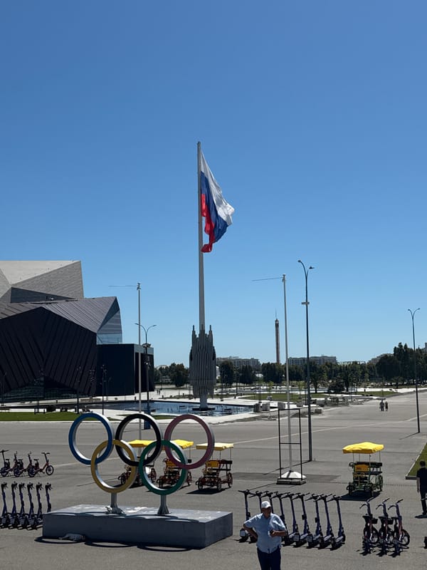 Russian flags wave at Sirius Olympic Park on sunny morning