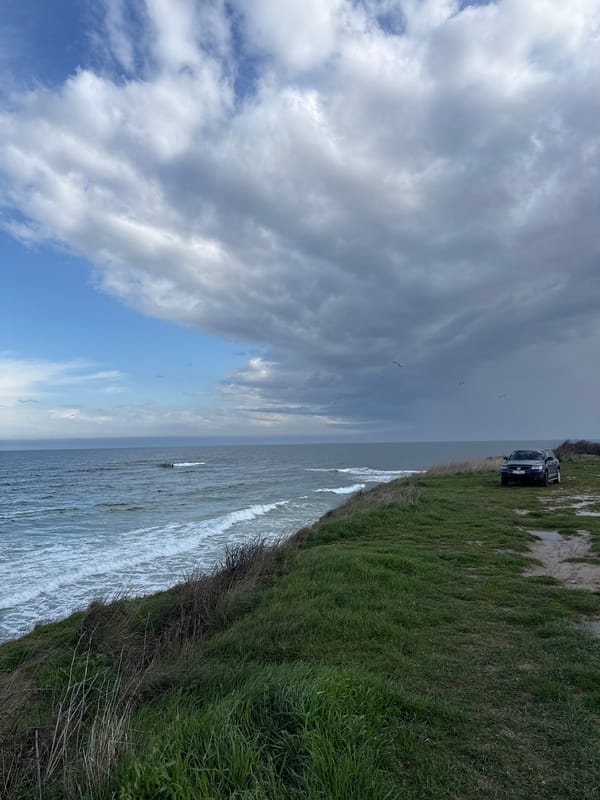 Car parked on coastal track near Nesebar, Bulgaria