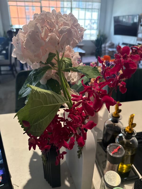 Pink hydrangeas and red orchids arranged in Los Angeles bouquet