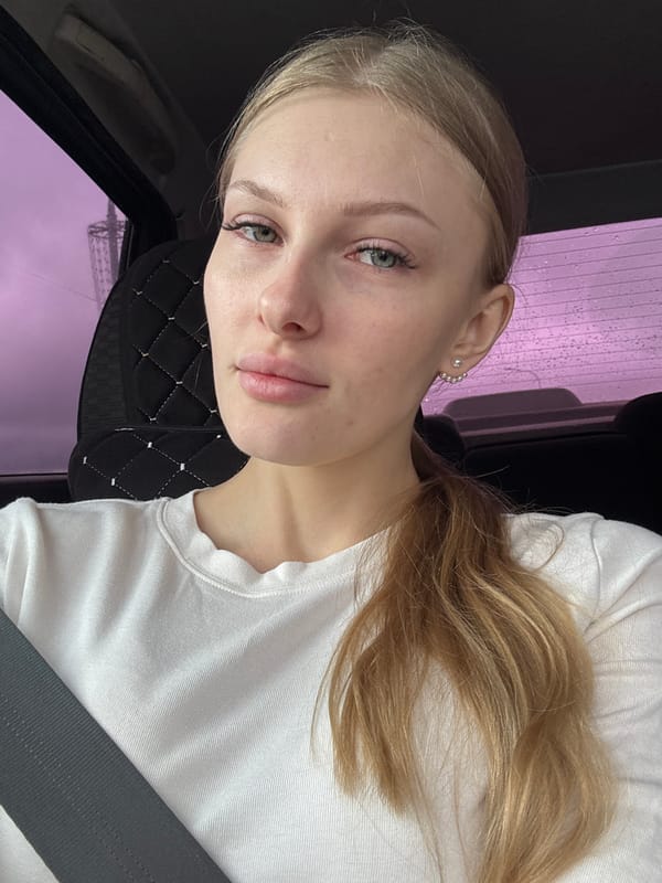Young woman photographed during car journey in Perm, Russia