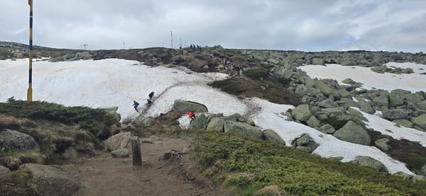 Hikers traverse snowy mountain terrain near Bistritsa, Bulgaria