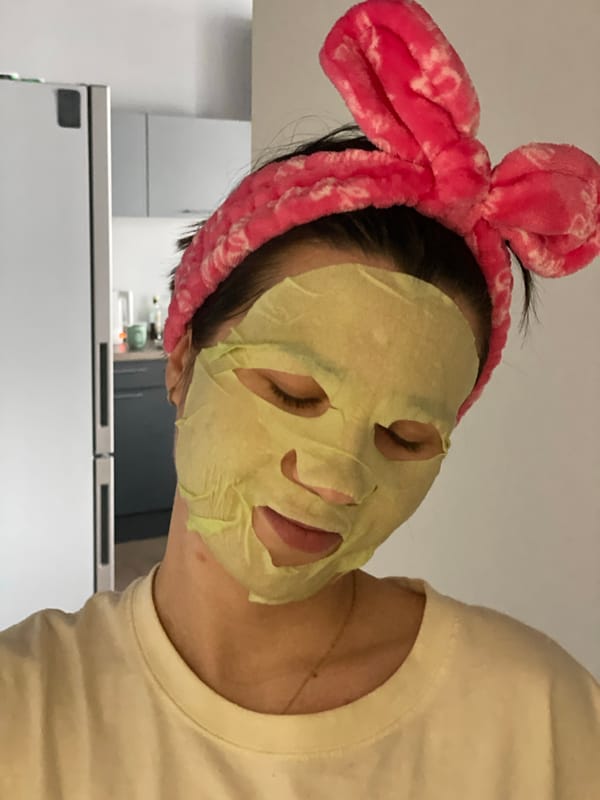 Person spotted wearing face mask, pink headband in Krasnoyarsk kitchen