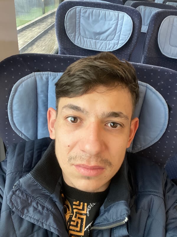 Train passenger photographed during morning commute near Pleven, Bulgaria