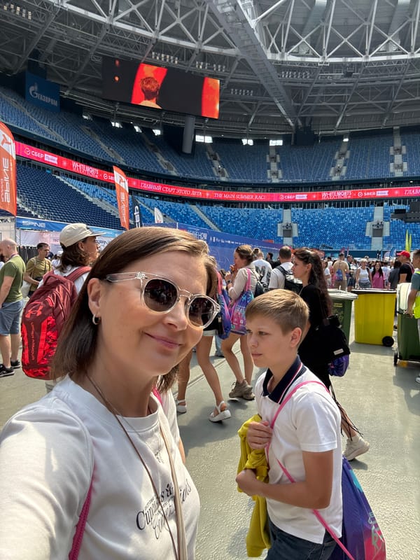 Selfies and smiles outside a Saint Petersburg stadium