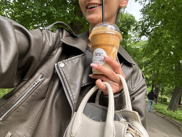 Woman enjoys morning iced coffee in Dupnitsa, Bulgaria