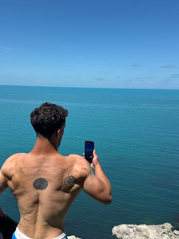 Young men exercise at clifftop gym overlooking Black Sea