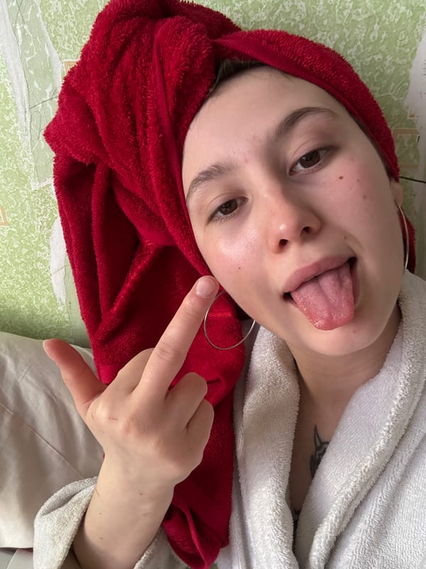 Young woman takes playful selfie portraits in Фоки, Russia