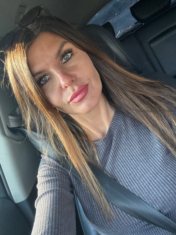 Woman takes car selfies in Chaikovsky, Russia