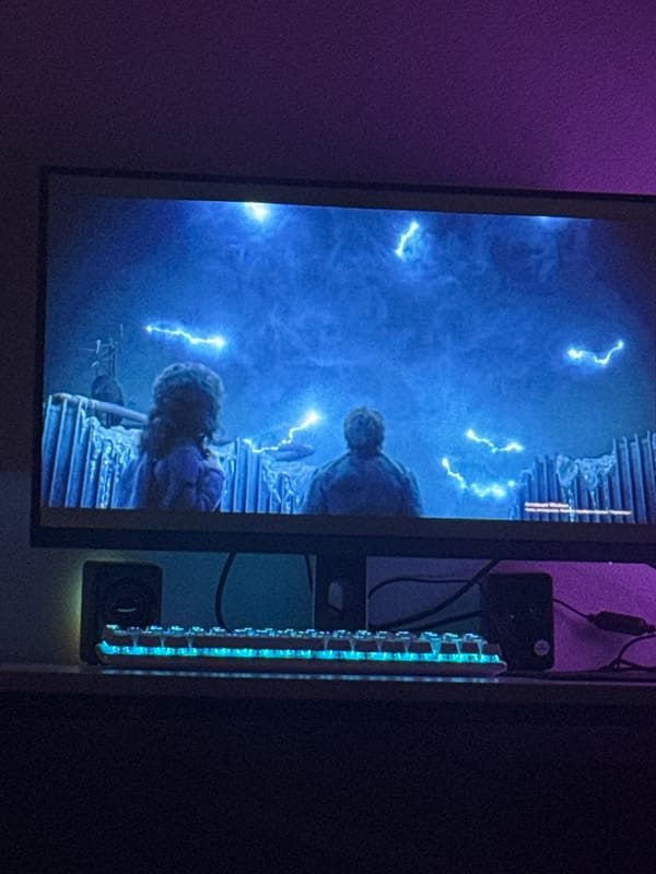 Monitor displays digital scene with lightning effects