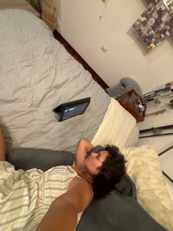 Woman rests with tablet in Puebla bedroom