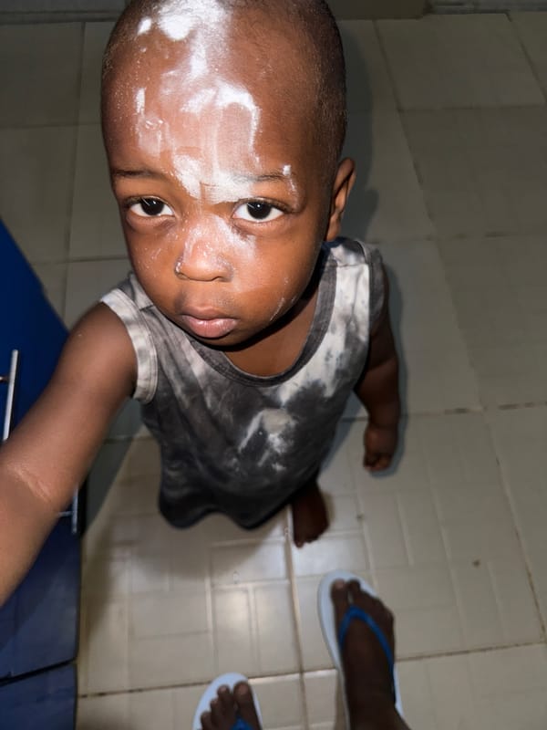 Mother and child captured in indoor moment in Sabon Tasha