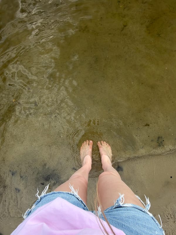 Wading and playing on the Dnipro River on a summer afternoon