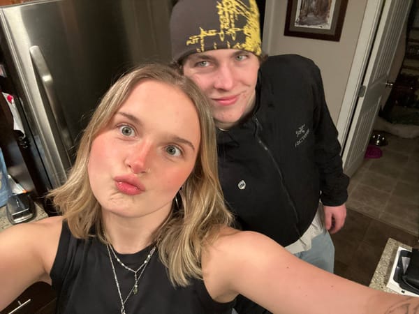Two people take indoor selfie in Whistler residence