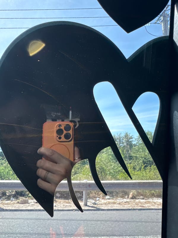 Black decorative cutout frames a clear blue sky in Quy Nhon