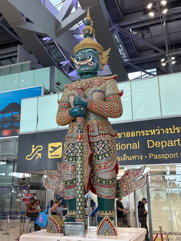 Ornate blue-faced statue displayed at Bangkok's Suvarnabhumi Airport