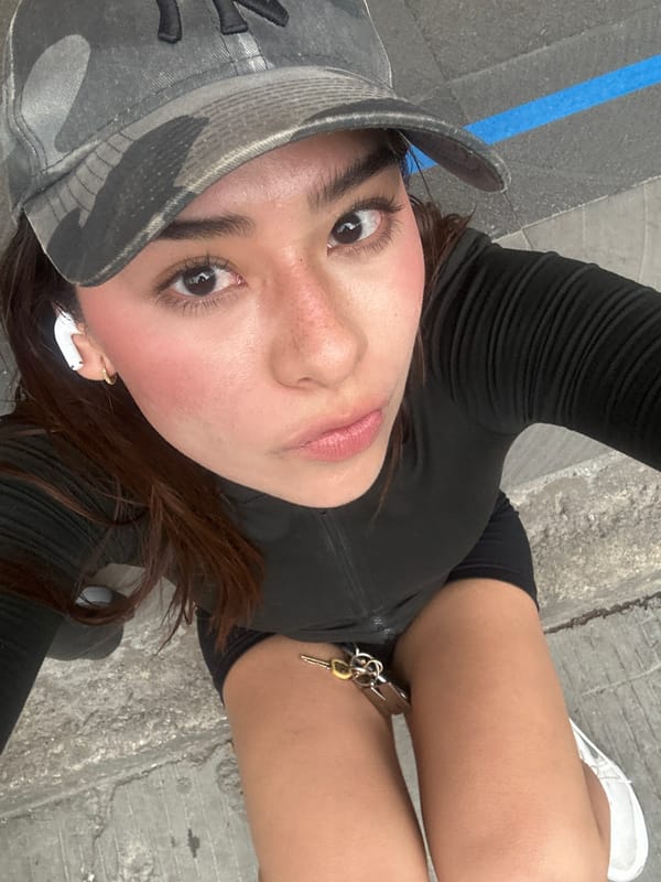 Friends taking selfies on a Puebla sidewalk
