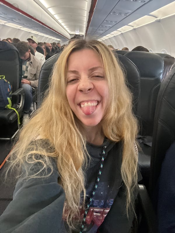 Woman makes silly face during flight near Amsterdam