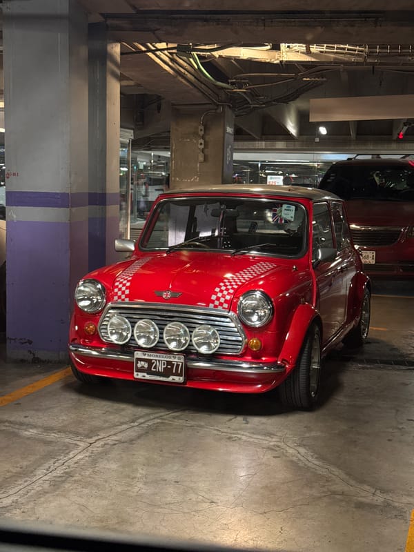 Classic Mini Cooper with checkerboard pattern spotted in Mexico City garage