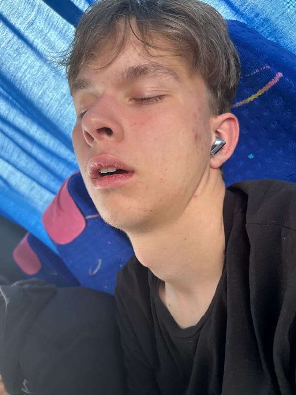 Young man sleeps on bus seat in Bulgaria