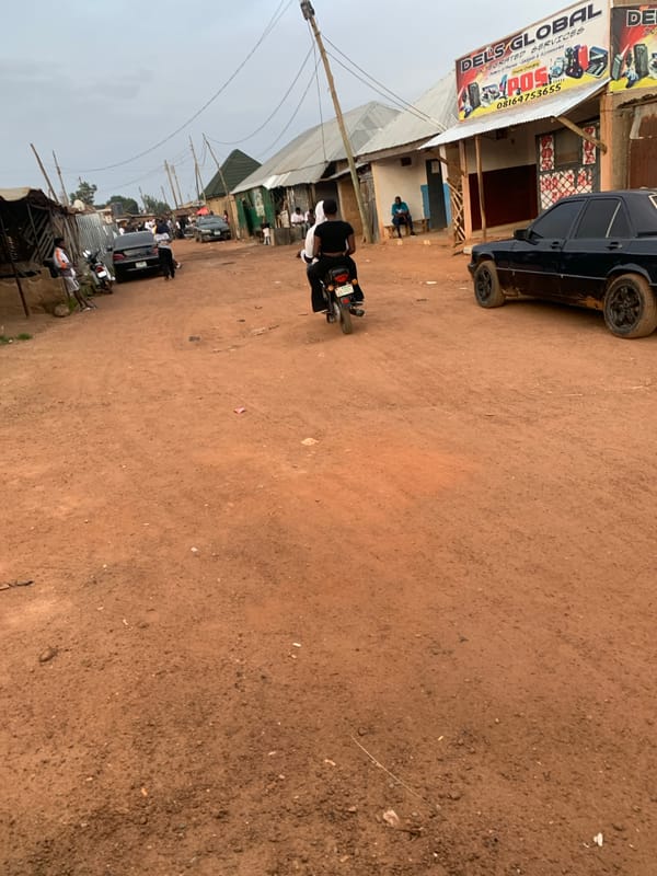 Street life along dusty roads in Bukuru and Du, Nigeria