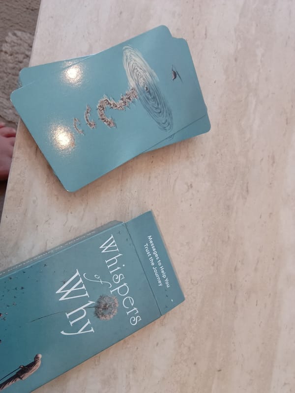 Spiritual cards and books documented in quiet home setting