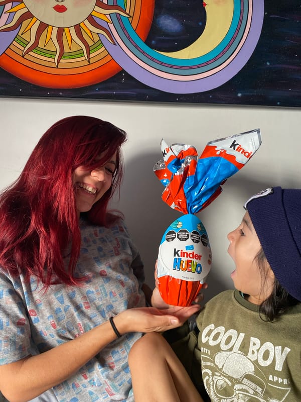 Mother and child share Easter chocolate, toys in Wilde