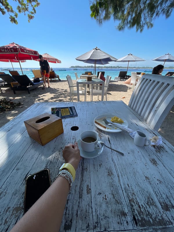 Lazy morning at a sandy beachfront café in Lombok