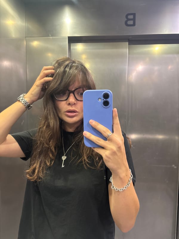 Elevator pause in Tel Aviv with a selfie and iced drink