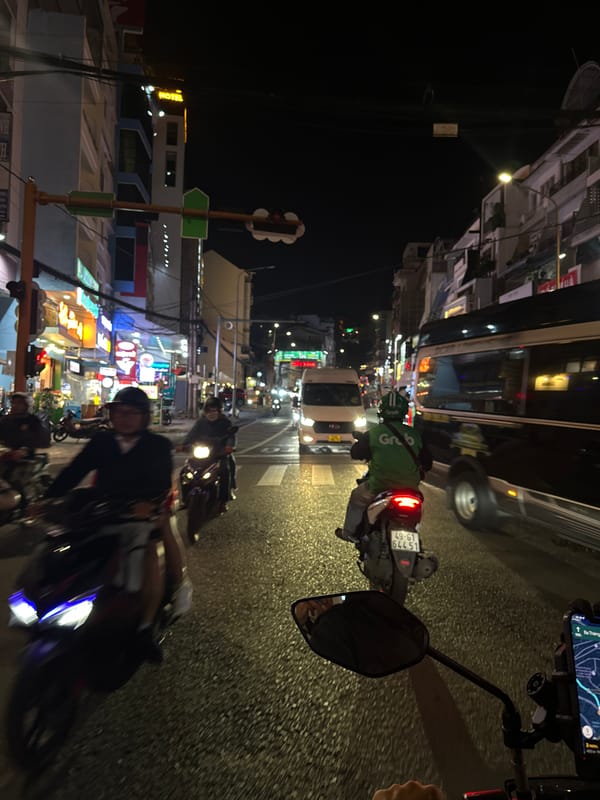 Nighttime streets and storefronts across central Đà Lạt