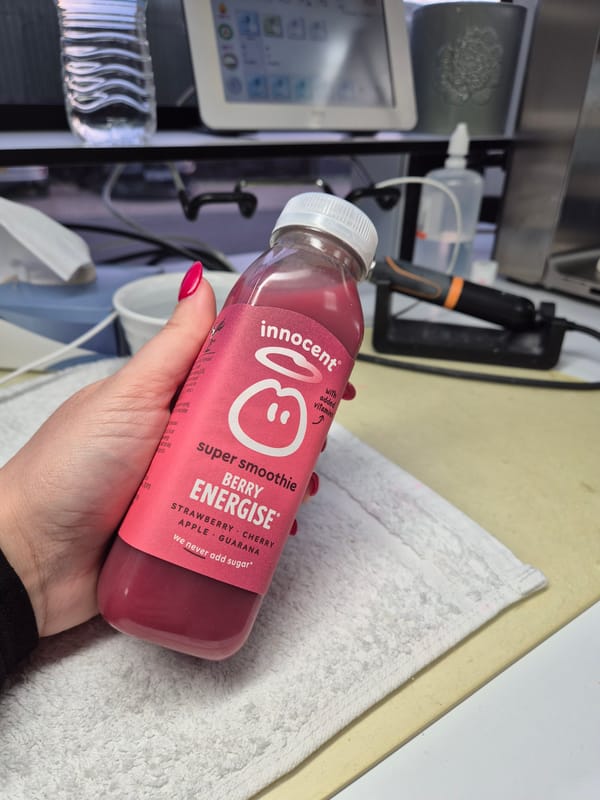 Person opens berry smoothie drink in West Suffolk morning