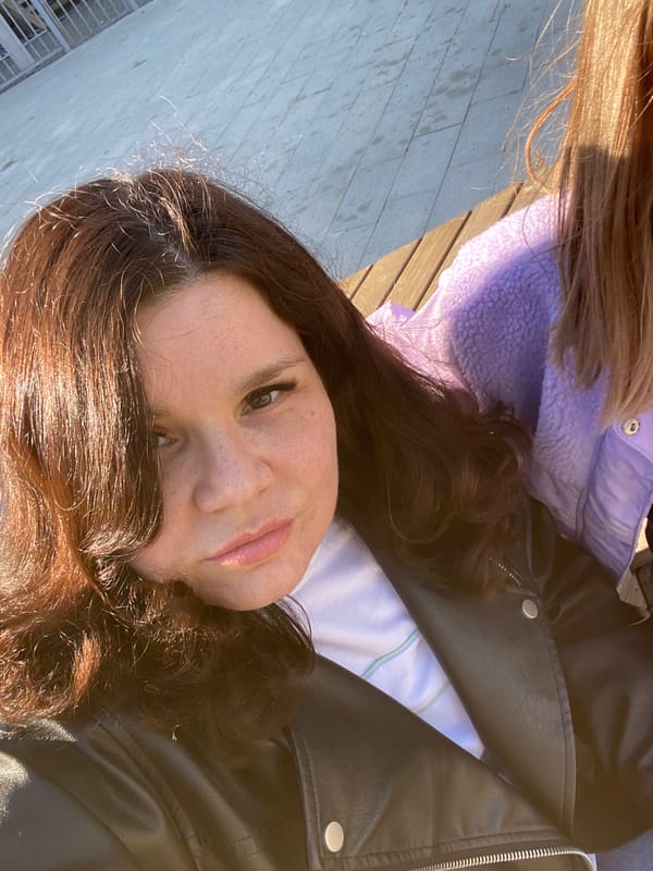 Woman visits sunny playground in Yekaterinburg as children play