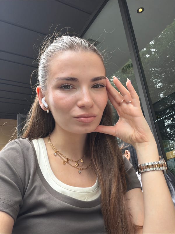 Woman takes morning selfies in Panyu District cafe scene