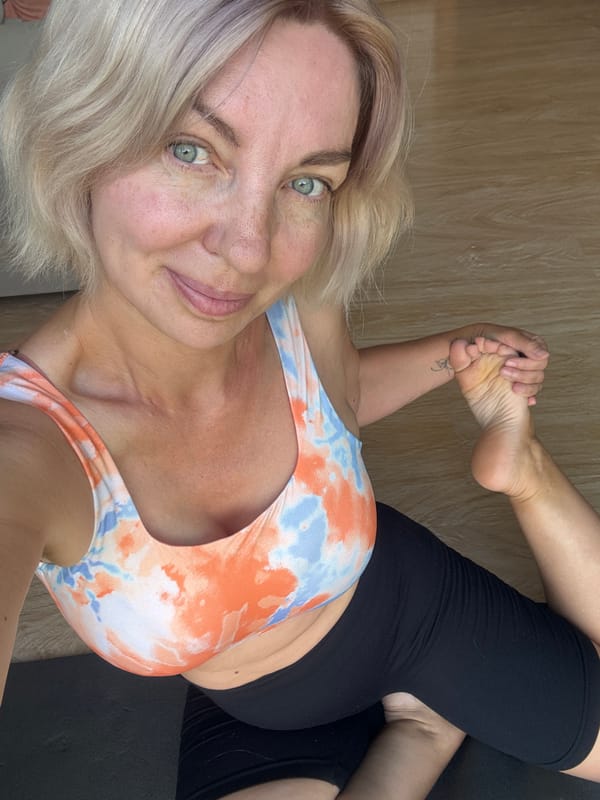 Yoga session on a black mat in Sochi, Russia
