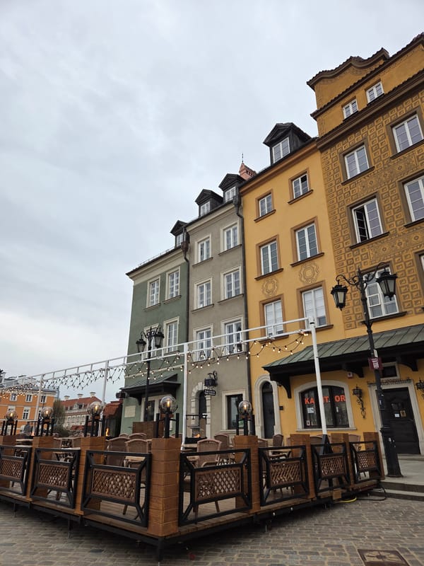 Film crew interviews woman in Warsaw's Old Town