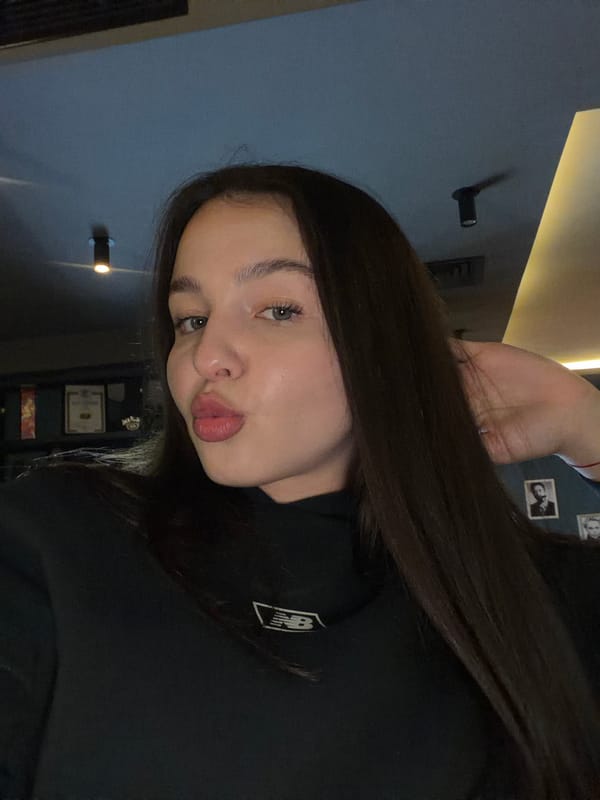 Couple Takes Selfies at Pernik Venue During Soccer Match