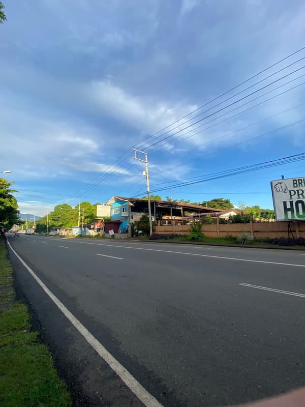 Roadside life along a Davao City street, stalls and all