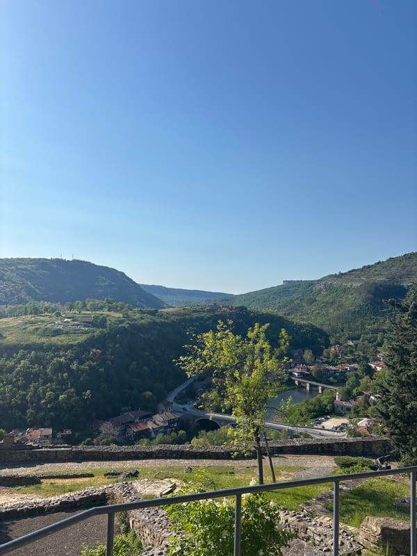 Tourist captures panoramic views of historic Veliko Tarnovo from fortress