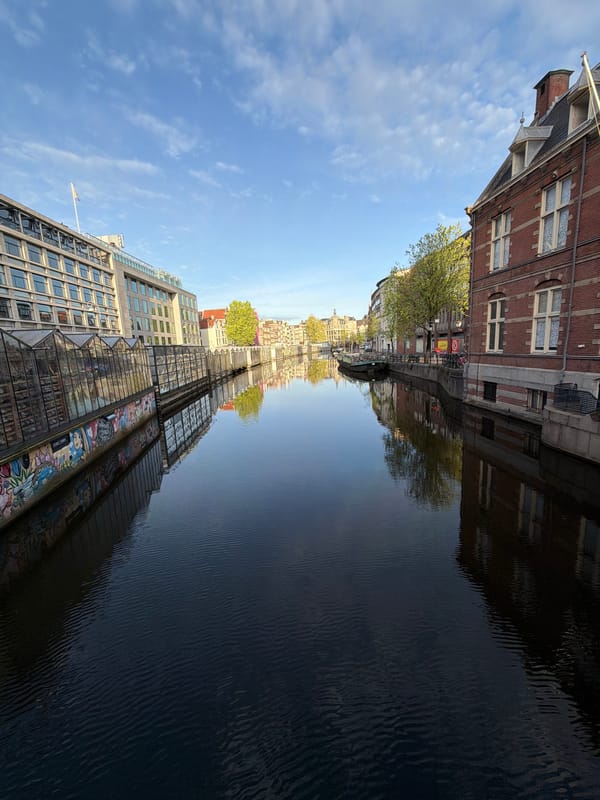 Morning scenes of Amsterdam canals and historic architecture documented