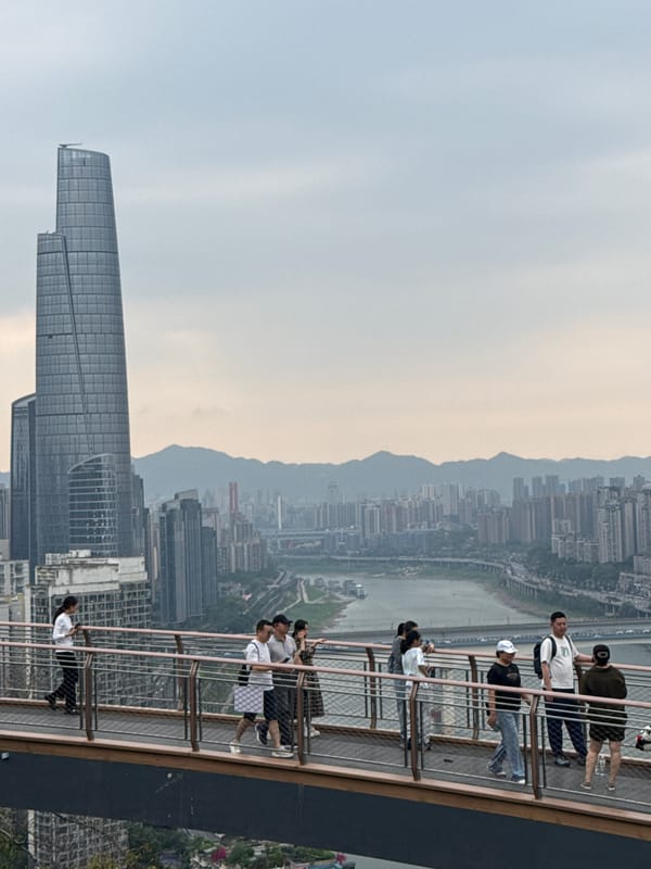 Tourists visit Chongqing observation decks and famous monorail station