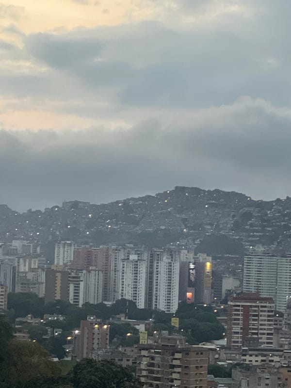 Evening scenes and laptop work documented in Caracas