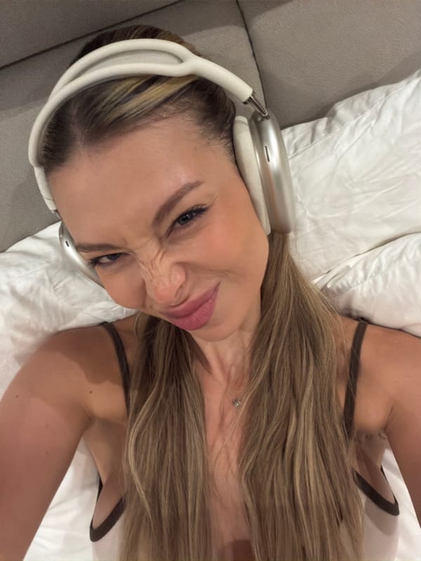 Woman takes selfies with headphones in Tibubeneng