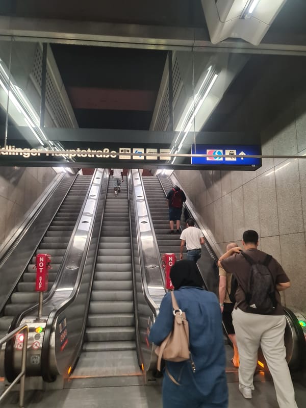 Commuter flow through Wien Mitte station escalators