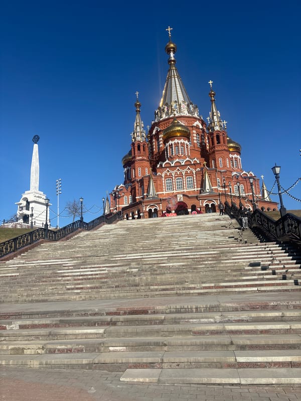Grand red-brick architecture documented under clear skies in Izhevsk