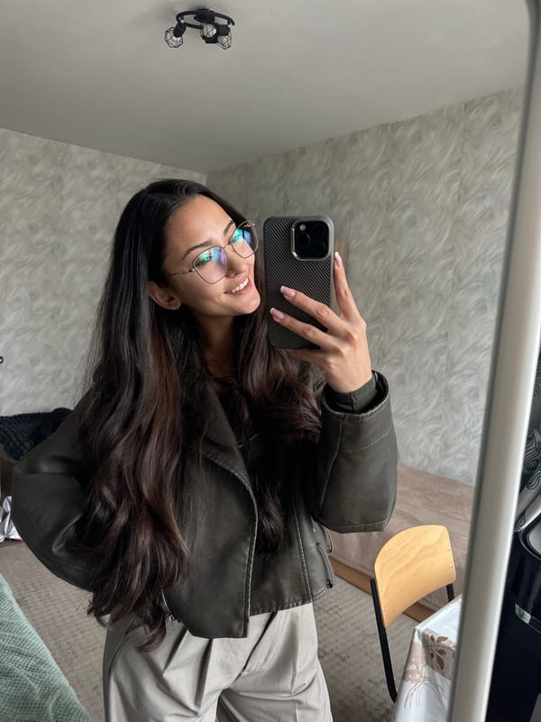 Woman takes mirror selfie at home in Sofia