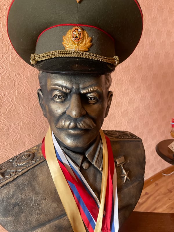 Indoor snapshots from Neryungri: a bust, a lamp, a selfie