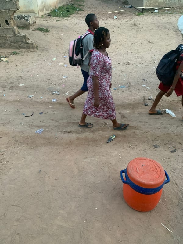 Daily life unfolds on Lokoja's dirt streets