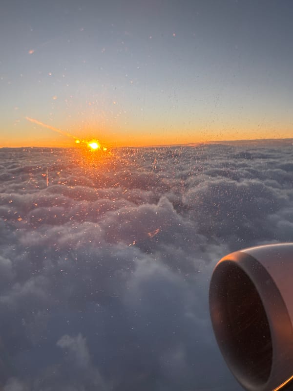 Passenger documents dramatic sunset from aircraft over Vecsés, Hungary
