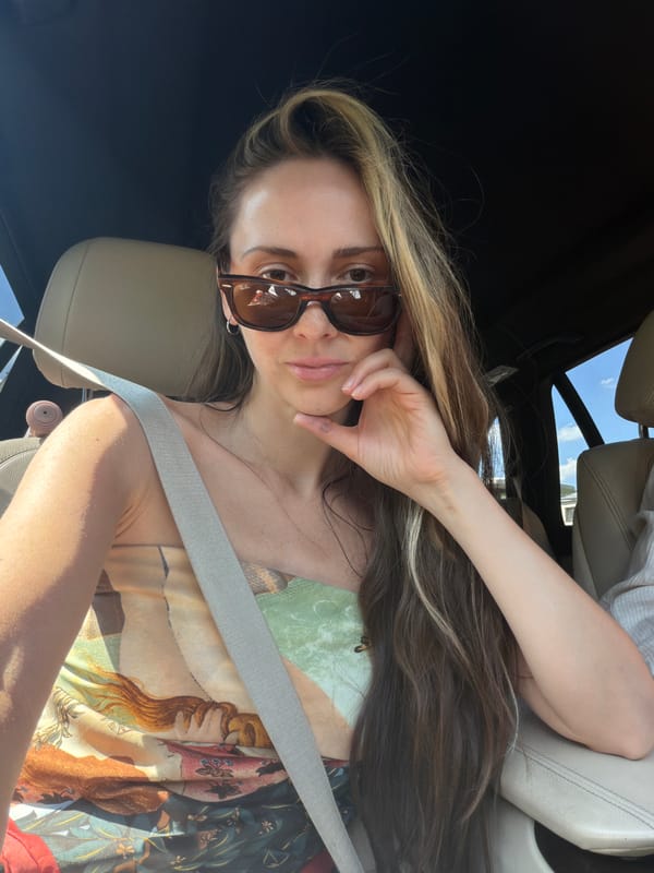 Woman poses in driver's seat in Moscow