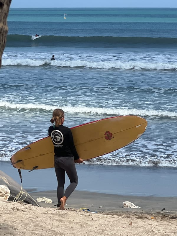 Kuta Beach in full swing — surf, sand, and beachside life