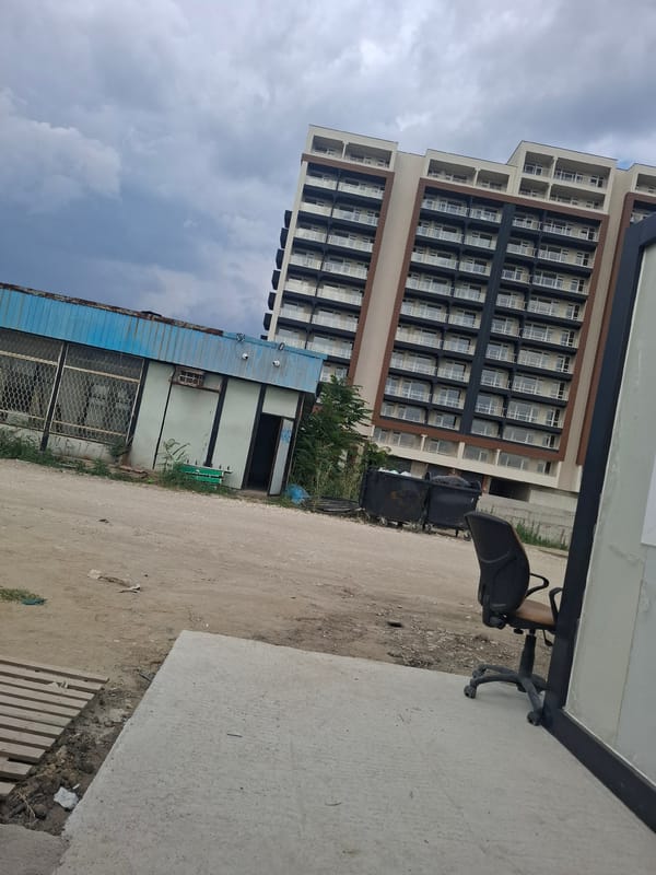 Plovdiv neighborhood mid-build: cranes, apartments, and street life
